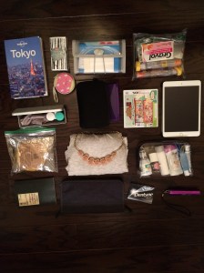 Left to right starting from top: Tokyo travel guide (thanks Christine and Ryan!), tissues, change purse (MC!!!), mini document folio with printed tickets/documents/travel insurance/prescription info for my epi pens, pouch of medicine I might need on the plane + epi pens, glasses case and contacts, DS, HAPPY HOME DESIGNER (Alex surprised me with this last minute.. omgomg I can't wait to play it), iPad Mini full of audio books/e-books/apps/shows to keep me busy, Momofuku Milk Bar Corn Cookies to snack on for breakfast, Extra outfit just in case, Toiletries for the plane, notebook, Passport wallet with boarding passes/currency/cards, gum, and Portable power stick.