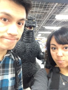 Picture with Godzilla! It's been decades since the attacks so they're more light-hearted about him now.